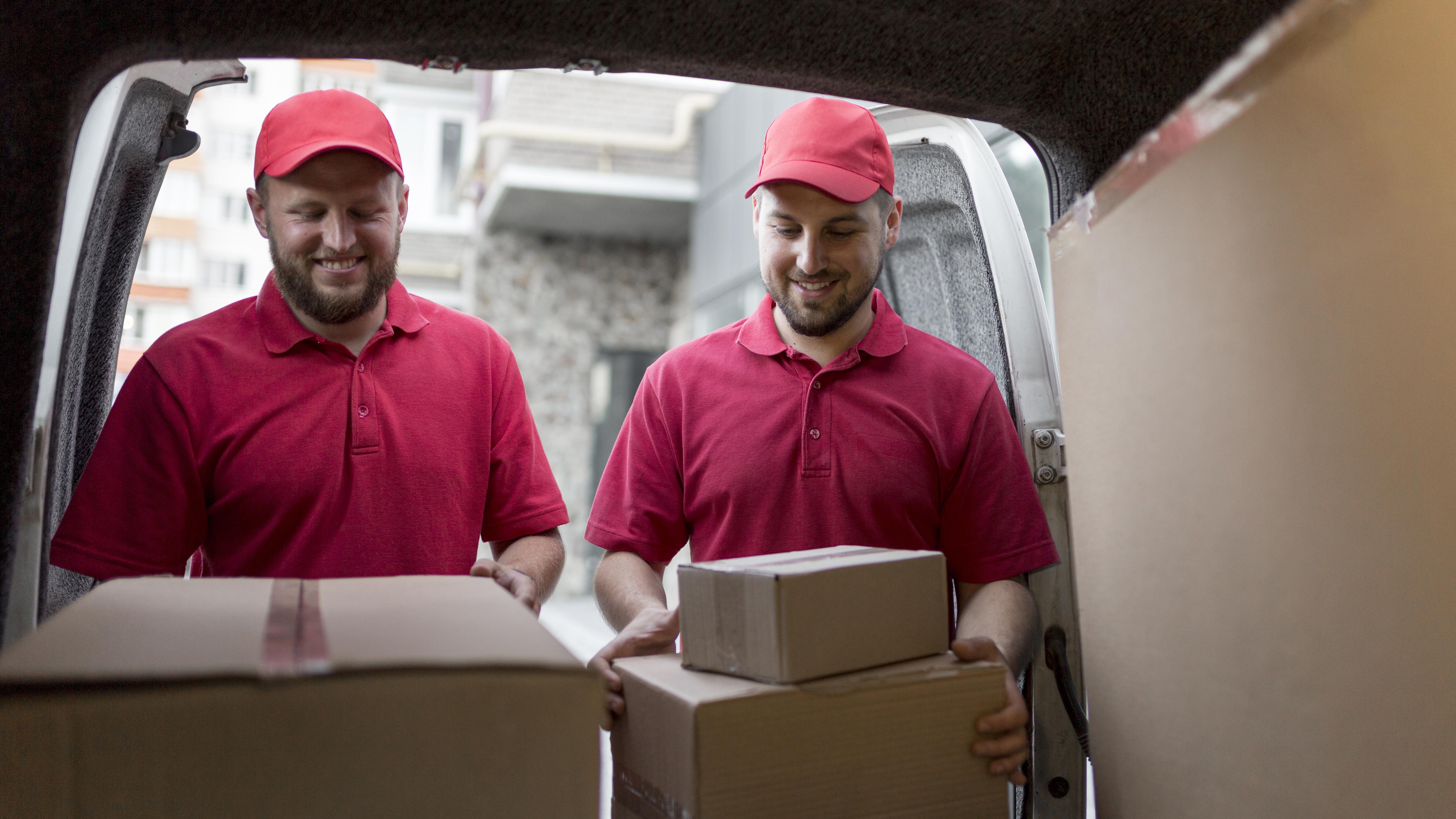 front view delivery man with packagaes