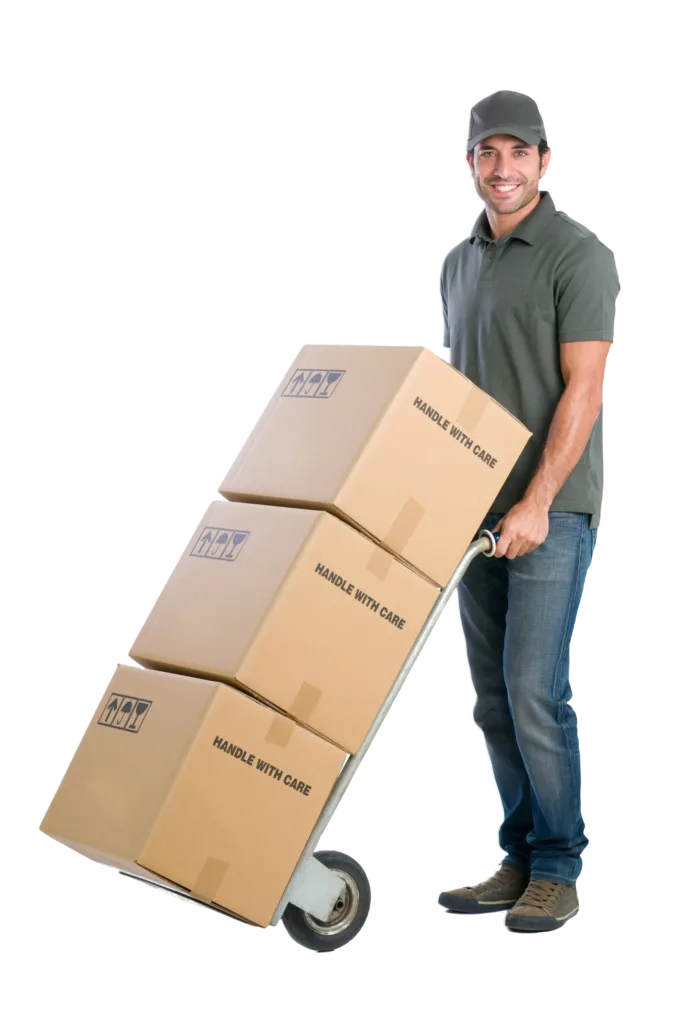 smiling young delivery man moving boxes with dolly isolated white background